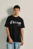 Camiseta unicolor oversize con texto college y manga corta