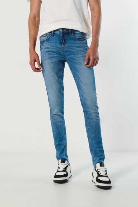 Jean súper skinny azul ceñido con bolsillos y tiro bajo