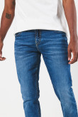 Jean azul skinny tiro bajo con ajuste ceñido y desgastes