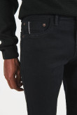 Jean skinny tiro bajo negro con cremallera y bolsillos