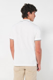 Camiseta unicolor tipo polo manga corta con botones