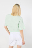 Camiseta oversize crop top verde con diseño de paletas