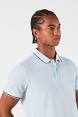 Camiseta unicolor tipo polo manga corta con botones