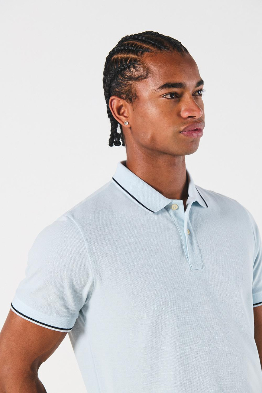 Camiseta unicolor tipo polo manga corta con botones