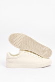 Tenis unicolores casuales con suela plana y texto estampado