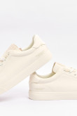 Tenis unicolores casuales con suela plana y texto estampado