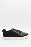 Tenis casuales negros con suelas planas blancas