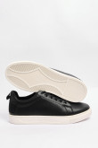 Tenis casuales negros con suelas planas blancas