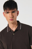 Camiseta unicolor tipo polo manga corta con botones