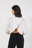 Blusa unicolor manga larga amplia con abertura en espalda