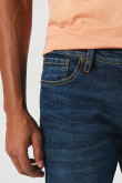 Jean slim tiro bajo ajustado azul oscuro con bolsillos