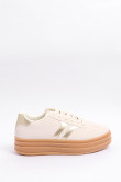 Tenis casuales unicolores con suelas altas y contrastes
