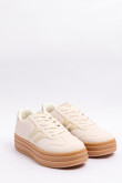 Tenis casuales unicolores con suelas altas y contrastes