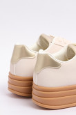 Tenis casuales unicolores con suelas altas y contrastes
