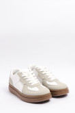 Tenis casuales unicolores con cortes y suelas planas