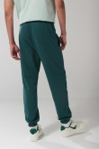 Pantalón unicolor jogger con elástico en bota y bolsillos