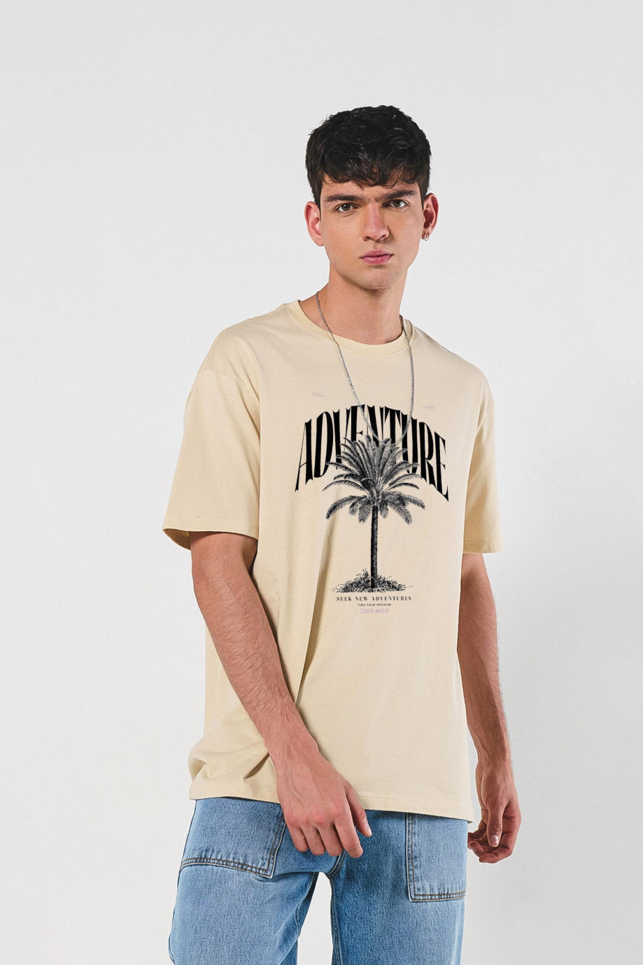 Camiseta cuello redondo oversize unicolor con arte de playa