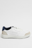 Tenis planos unicolores con perforaciones y contrastes