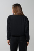Buzo negro crop top con estampado de Los Picapiedra