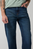 Jean azul oscuro baggy con bota ancha y tiro medio