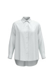 Blusa unicolor oversize con cuello camisero y manga larga