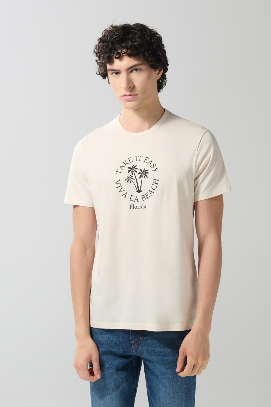 Camiseta unicolor cuello redondo con arte college de playa
