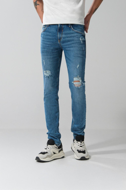 Jean skinny azul claro ajustado con rotos y tiro bajo
