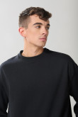 Buzo negro oversize con cuello redondo y manga larga