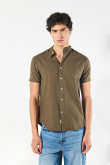 Camisa verde oscura cuello nerú con diseños de puntos