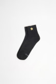 Medias unicolores cortas con diseño de estrella