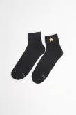 Medias unicolores cortas con diseño de estrella