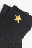 Medias unicolores cortas con diseño de estrella