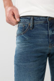 Jean azul oscuro slim con tiro bajo, rotos y parche interno