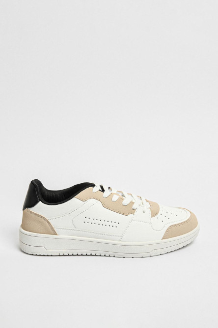 Tenis planos unicolores con perforaciones y contrastes