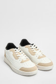 Tenis planos unicolores con perforaciones y contrastes
