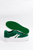 Tenis verdes de plataforma con contrastes blancos