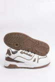 Tenis casuales unicolores con suelas planas y contrastes