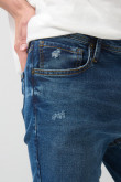 Jean slim ajustado azul oscuro con tiro bajo y rotos