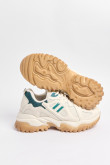 Tenis chunky en color crema claro con contraste color verde