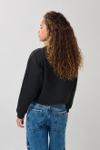 Buzo crop top negro con arte college y cuello redondo