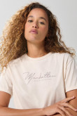 Camiseta unicolor crop top con arte college delantero