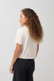 Camiseta unicolor crop top con arte college delantero