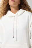 Buzo oversize perchado crema con capota y bolsillo