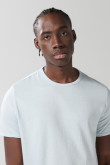 Camiseta unicolor con puños y cuello redondo en rib