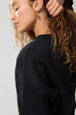 Buzo unicolor perchado oversize cuello redondo