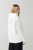 Buzo crema oversize con arte college, capota y manga ranglan