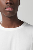Camiseta unicolor en algodón con manga corta y hombro rodado