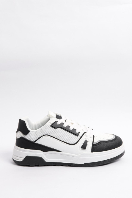 Tenis casuales unicolores con suelas planas y contrastes