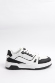 Tenis casuales unicolores con suelas planas y contrastes