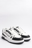 Tenis casuales unicolores con suelas planas y contrastes